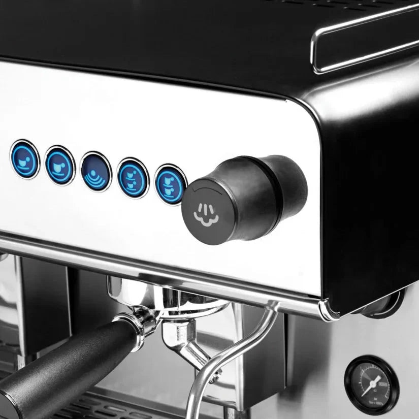 Close-up of a coffee machine with control panel and brewing components.