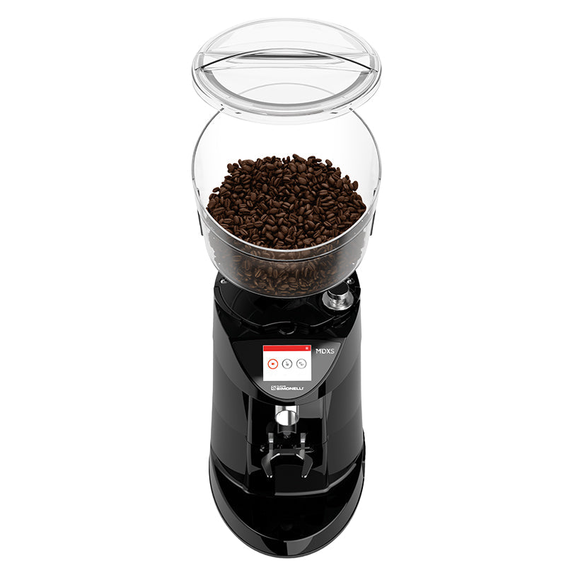 Black coffee grinder with a clear container of coffee beans on a white background
