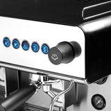 Close-up of a coffee machine with control panel and brewing components.