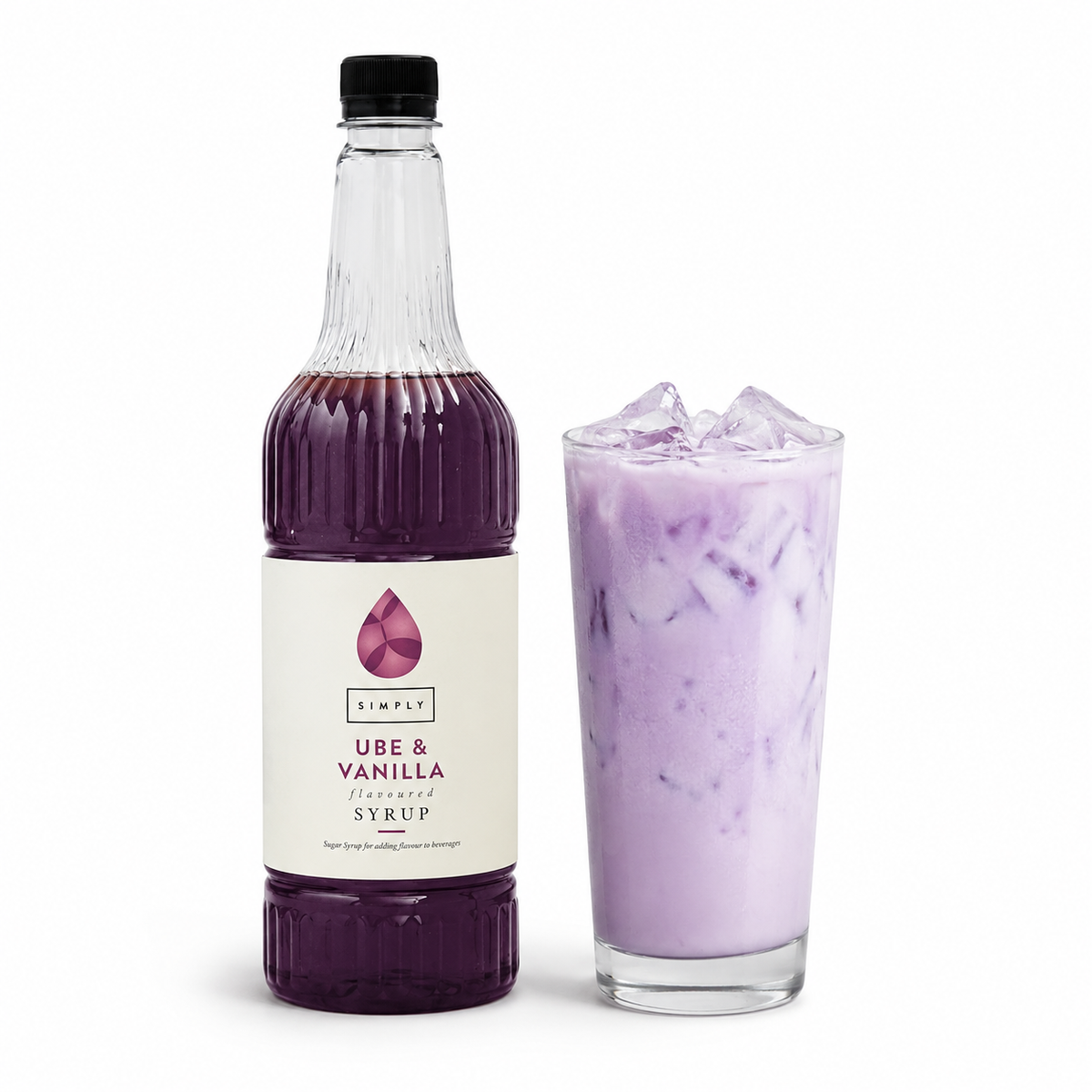 Bottle of Ube & Vanilla syrup next to a glass of iced drink on a white background