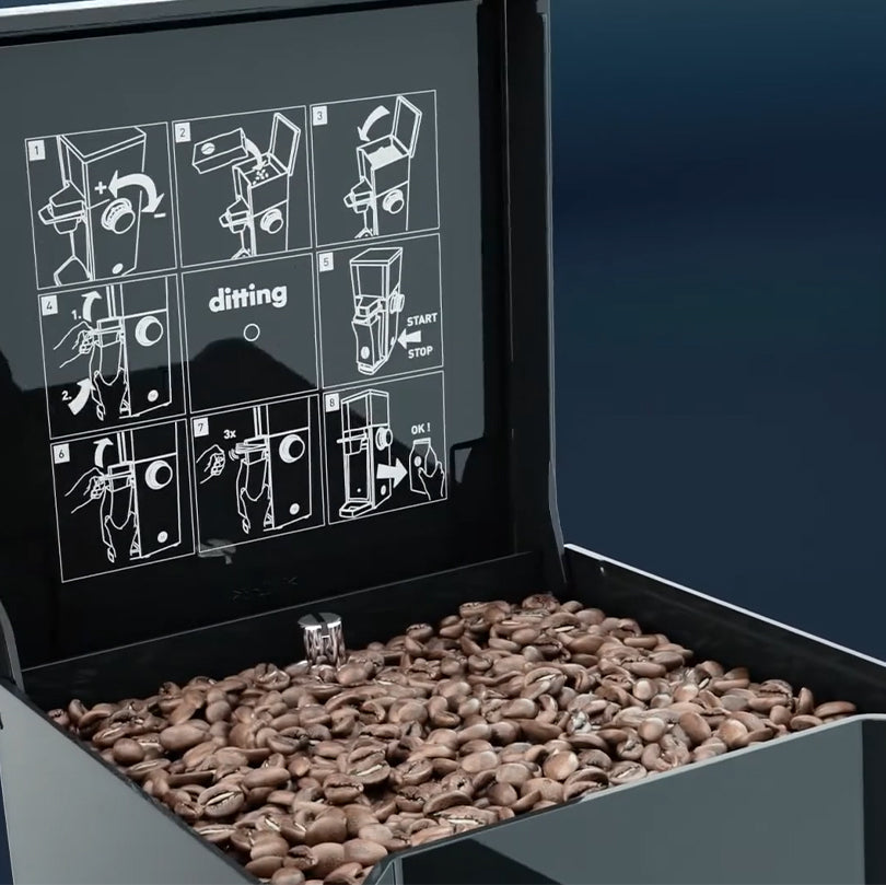 Arcade machine filled with coffee beans and a digital display showing step-by-step instructions.