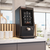 Bravilor Esprecious 22 Bean-to-Cup Coffee Machine – modern design with user-friendly touchscreen, dual canisters for coffee beans and instant ingredients, automatic rinsing program, and capacity for up to 220 cups per day. Perfect for large-scale environments.