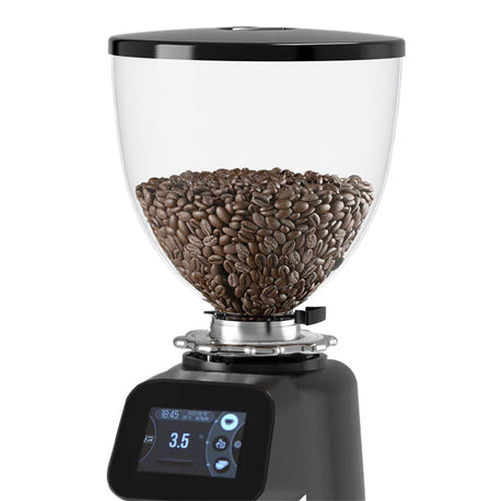 Coffee grinder with coffee beans inside on a white background