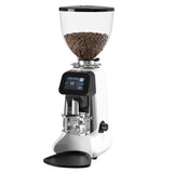 Coffee grinder with a clear container of coffee beans on a white background