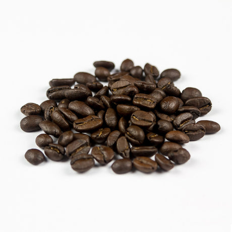 Colombia Huila dark roast speciality coffee beans close up – oily surface and deep roast