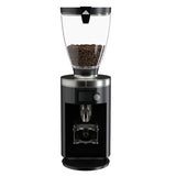 Coffee grinder with a clear container of coffee beans on a white background