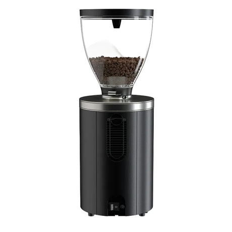 Black coffee grinder with clear top containing coffee beans on a white background