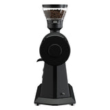 Black coffee grinder with coffee beans on a white background