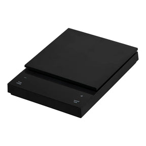 A black Hario Polaris Coffee Scale, with a flat platform on top and digital display on the front.