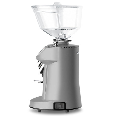 Silver coffee grinder with clear top on a white background