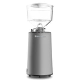 Silver coffee grinder with clear top on a white background