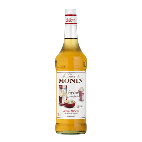 A bottle of Monin Popcorn flavor syrup with the label showing an illustration of a popcorn machine and text indicating the product name and size.