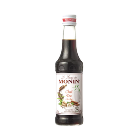 Bottle of Monin Chai Tea syrup on a white background