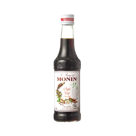Bottle of Monin Chai Tea syrup on a white background