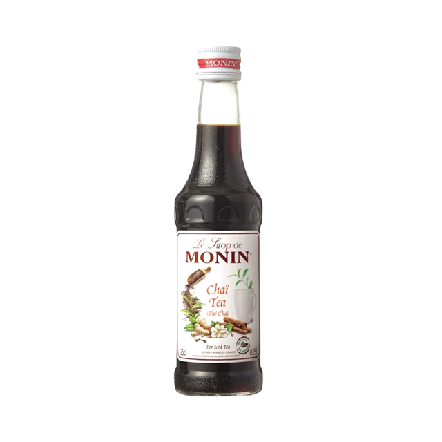 Bottle of Monin Chai Tea syrup on a white background