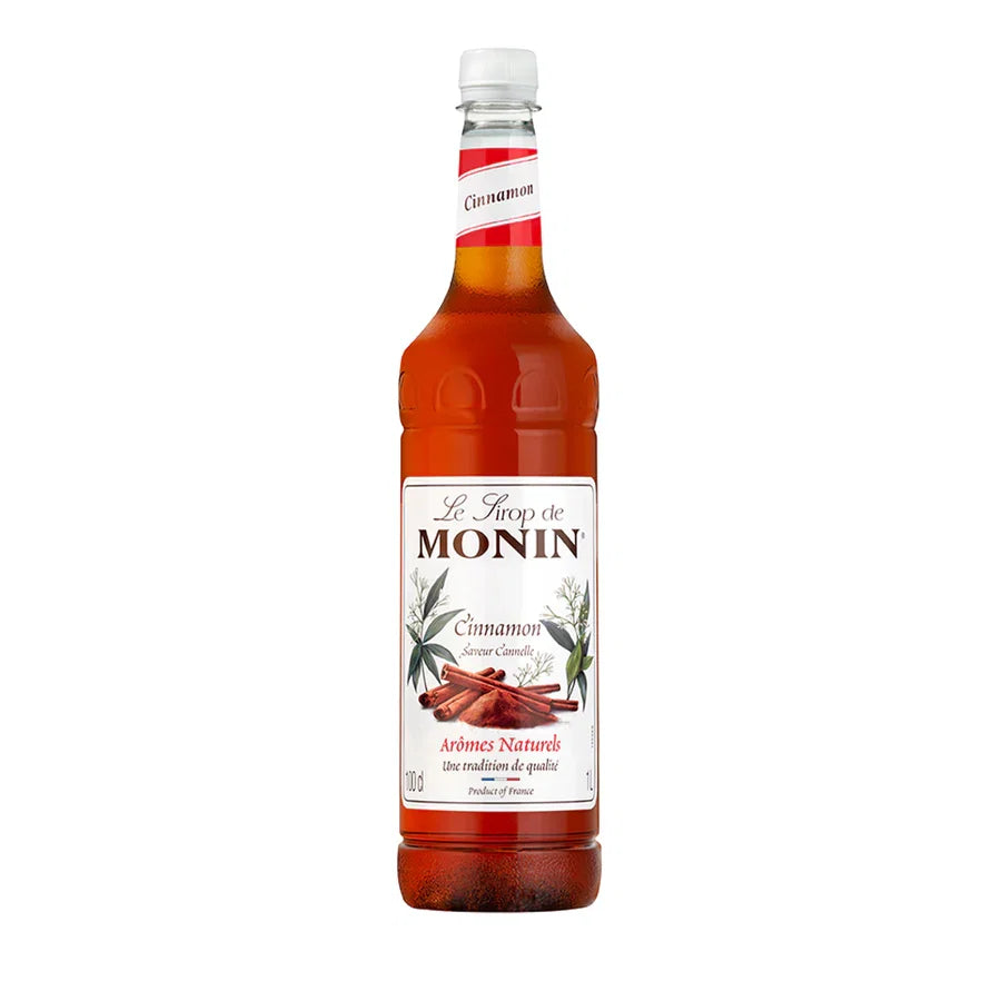 A bottle of Monin Coffee Syrup with cinnamon roll flavor, 1 liter size.