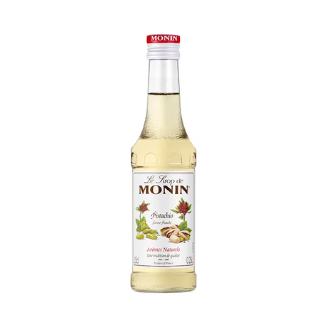 Bottle of Monin pistachio syrup on a white background
