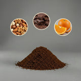 Heap of ground coffee with inset images of nuts, chocolate, and oranges on a gray background