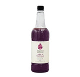 Bottle of Ube & Vanilla syrup on a white background