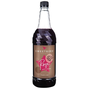 Bottle of Sweetbird Rose syrup on a white background