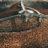 Coffee grinder with coffee beans in a container