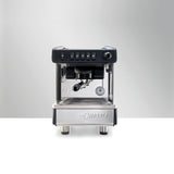 La Cimbali M26 SE espresso machine, ideal for cafés and restaurants. Features Italian craftsmanship, ThermoDrive Technology for consistent temperature control, and energy-saving mode. Available in sleek black and white finishes for reliable, barista-quality coffee service.
