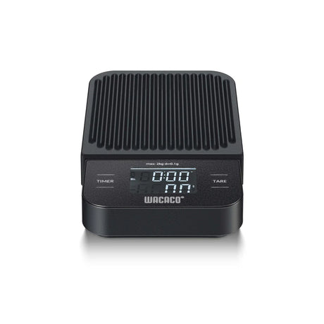 Black Wacaco coffee scale with digital display on a white background
